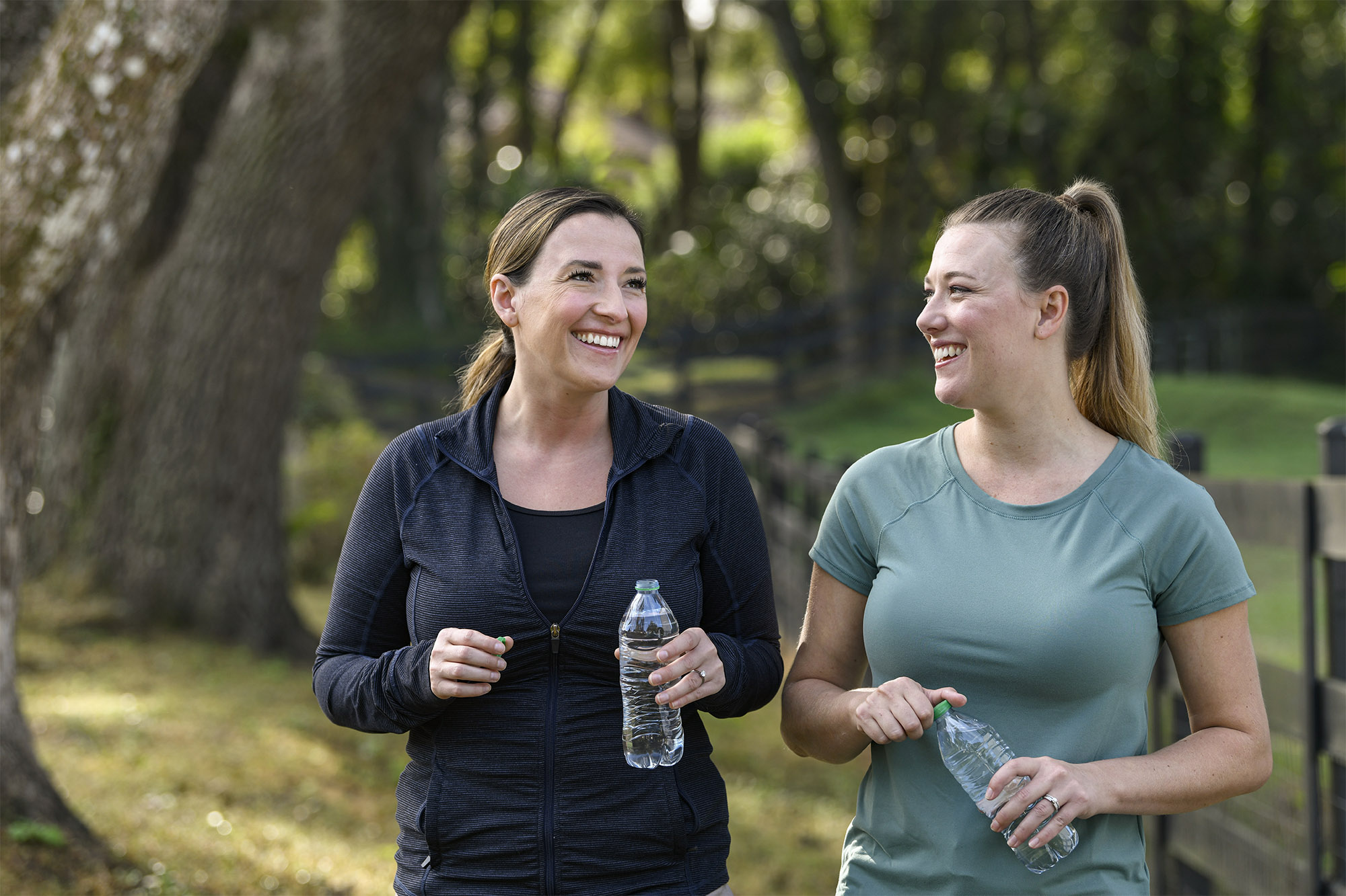 Two women walking together.